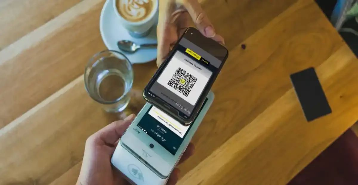 Contactless QR code payment and digital ordering system in modern cafe setup