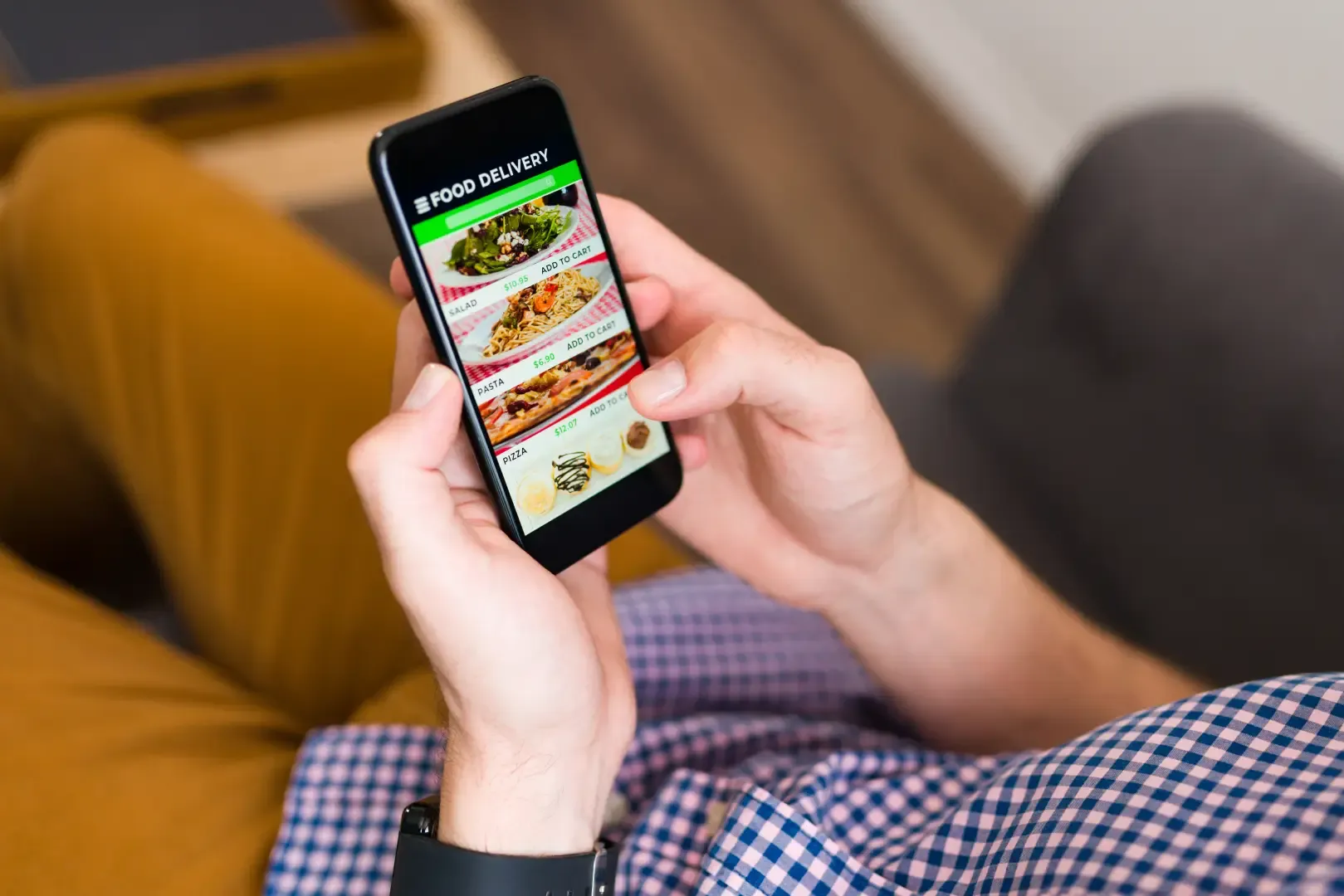 Guest using a smartphone to browse a QR code menu hotel system and place a hotel room service ordering request