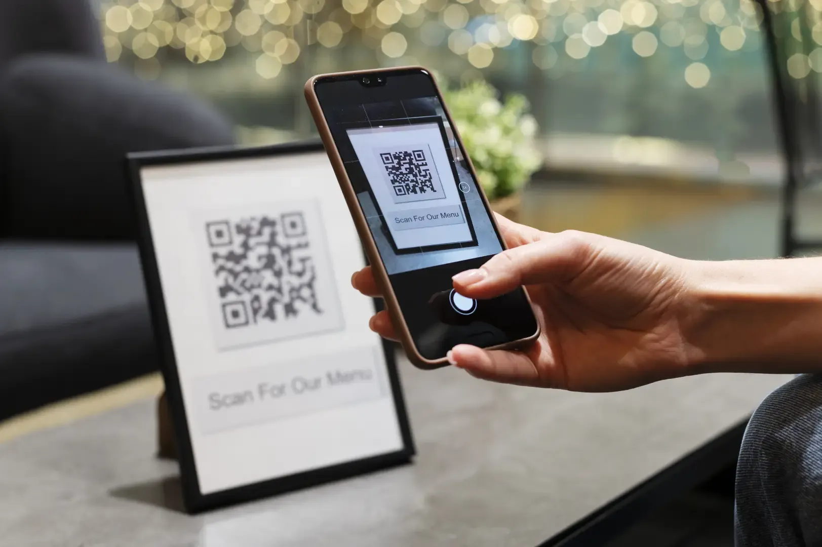 Guest scanning a QR code menu hotel display to browse menu items and place a contactless room service order